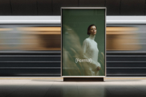 Vertical screen showing woman in white sweater against green