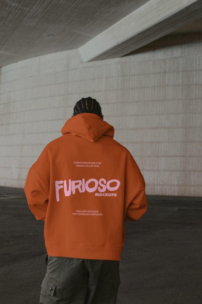 Rust hoodie back view, industrial concrete background architecture