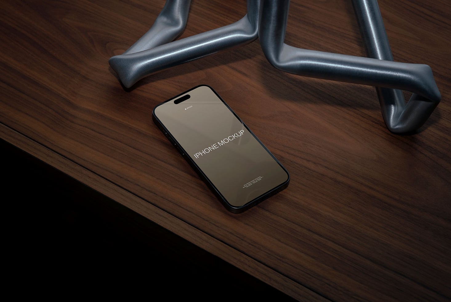 iPhone mockup with beige screen on desk with metal chair legs, warm wood surface
