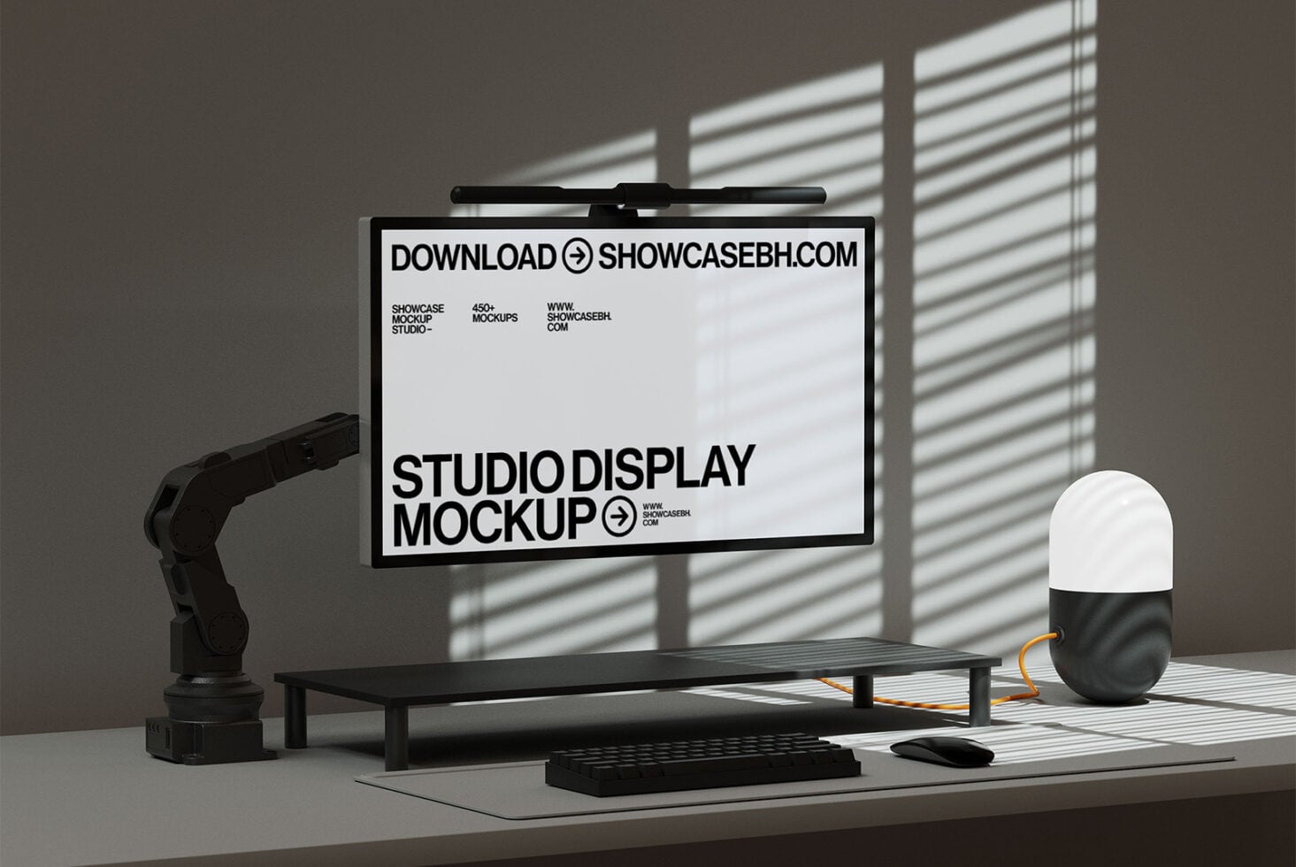 Studio workspace monitor displaying all white layout with bold text, robot arm nearby