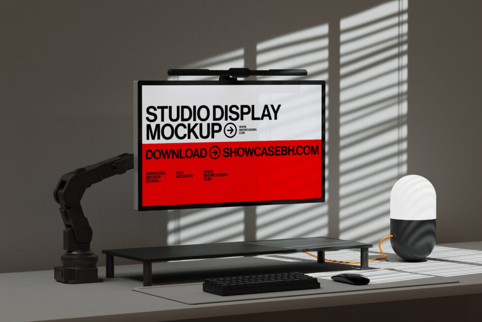 Desk setup monitor showing white top red bottom layout, robotic arm left side
