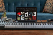 Macbook screen showing music workspace mockup with keyboard underneath on coffee table
