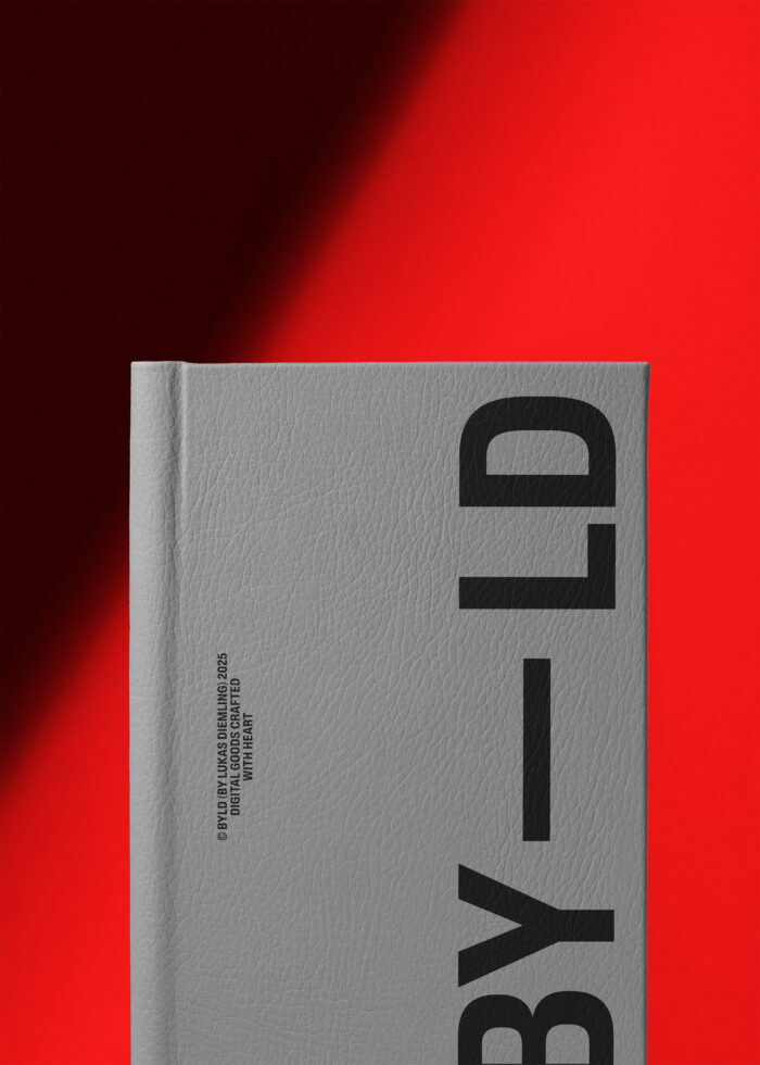 Light gray hardcover book with bold black geometric logo against red backdrop