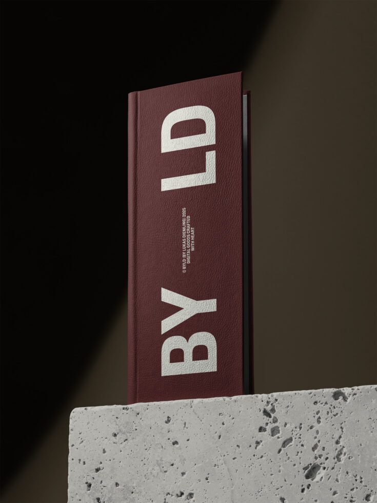 Maroon hardcover book displayed on concrete pedestal with white letters BYL logo