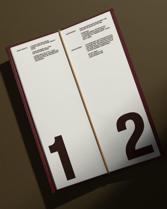 Open hardcover book with burgundy spine showing numbered pages 1 with instructions text