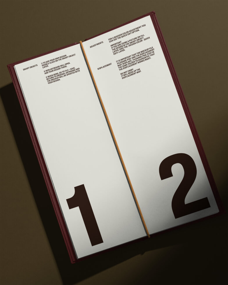 Open hardcover book with burgundy spine showing numbered pages 1 with instructions text