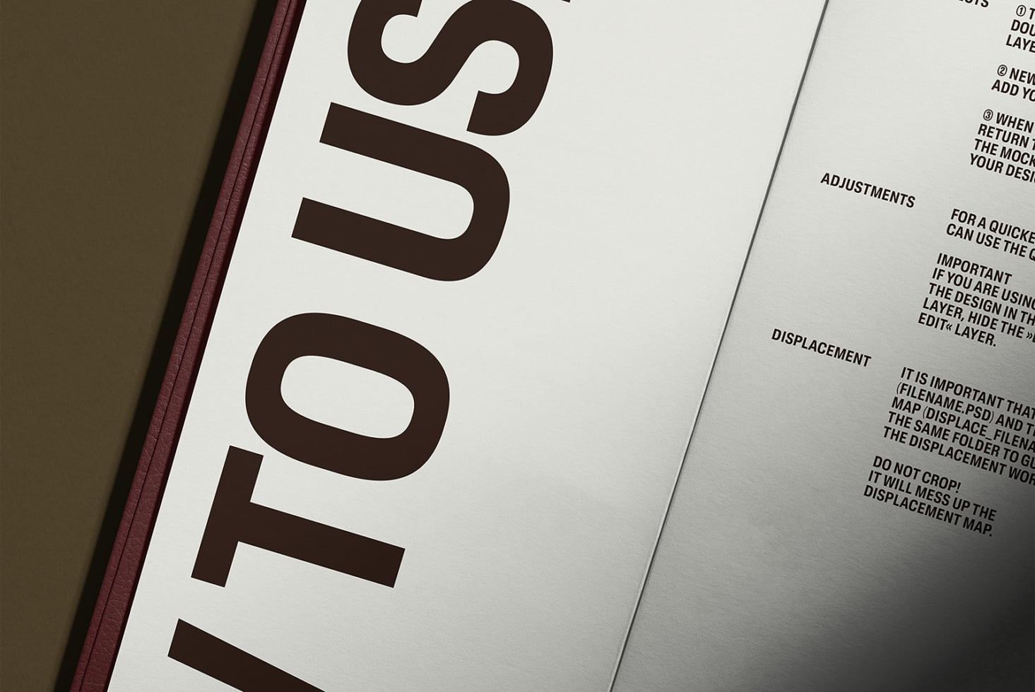 Close-up of open hardcover book with burgundy spine showing interior numbered pages
