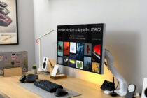 Apple Pro XDR monitor mockup on desk showing colorful portfolio grid