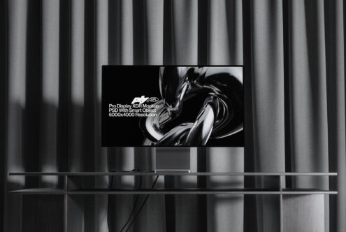 Modern living room with TV on striped curtain backdrop showing abstract swirl design