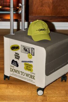 Hand cart mockup with yellow cap, colorful stickers on cream body