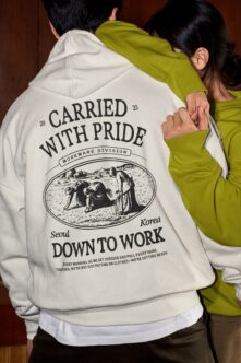 White hoodie with chartreuse jacket, Carried with Pride pastoral print design