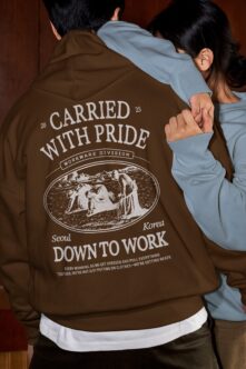 Carried with Pride hoodie on couple, engraved pastoral workwear design shown