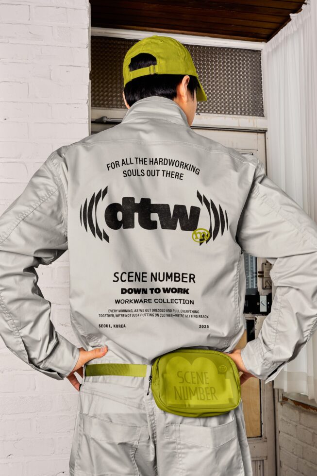 Cream jacket back view with neon yellow cap, showing workwear collection design