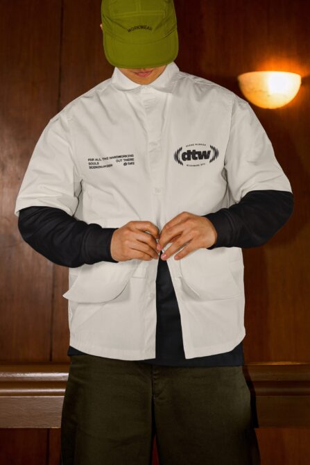 Lime cap styled with white shirt, black sleeves, featuring embroidered branding