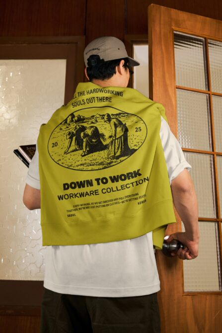 Lime green sleeveless vest with black illustrated workers on back