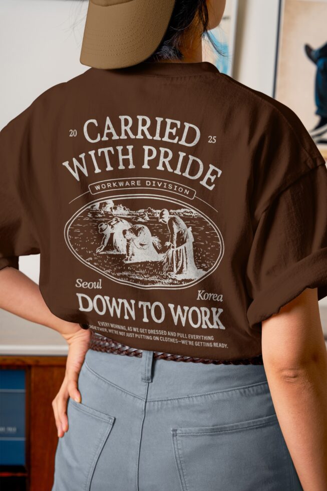 Back shot of brown tee with Carried With Pride vintage workwear design