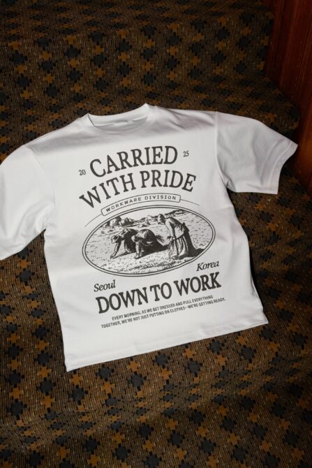 White tee featuring Carried With Pride workwear graphic in black ink