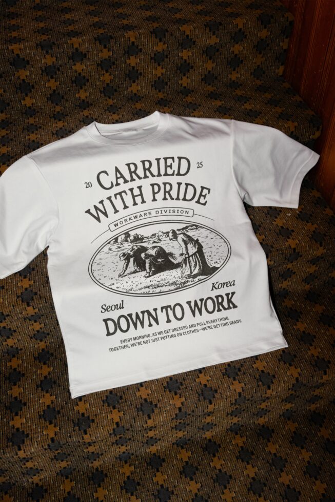White tee featuring Carried With Pride workwear graphic in black ink