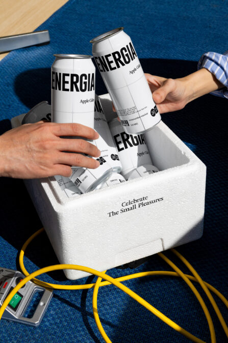 White cans stacked in foam cooler showing mockup template for branding projects