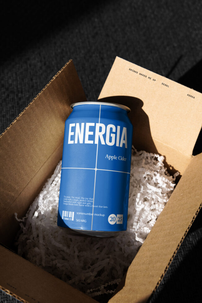 Blue Energia apple cider can in cardboard box with kraft paper