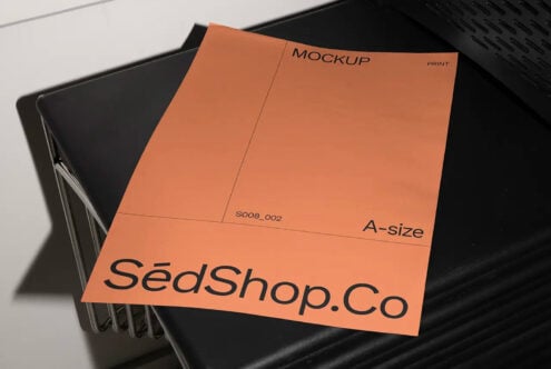 Orange A-size print mockup with SedShop.Co branding stacked on black trays