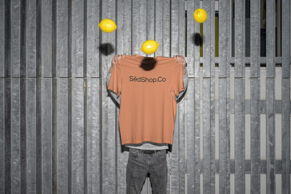 Peach t-shirt mockup with SedShop.Co text, figure with yellow lemons background