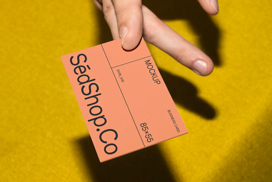 Coral folded business card mockup with vertical text layout showing SedShop.Co branding