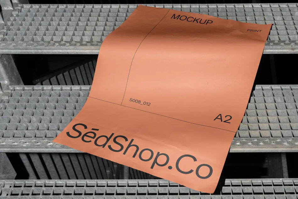 Orange A2 mockup with SedShop.Co branding on concrete grating surface