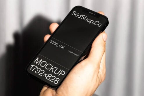Black phone mockup in hand displaying SédShop branding with dark screen layout