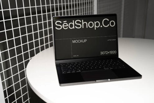 Dark laptop showing black mockup screen on modern minimal desk setup