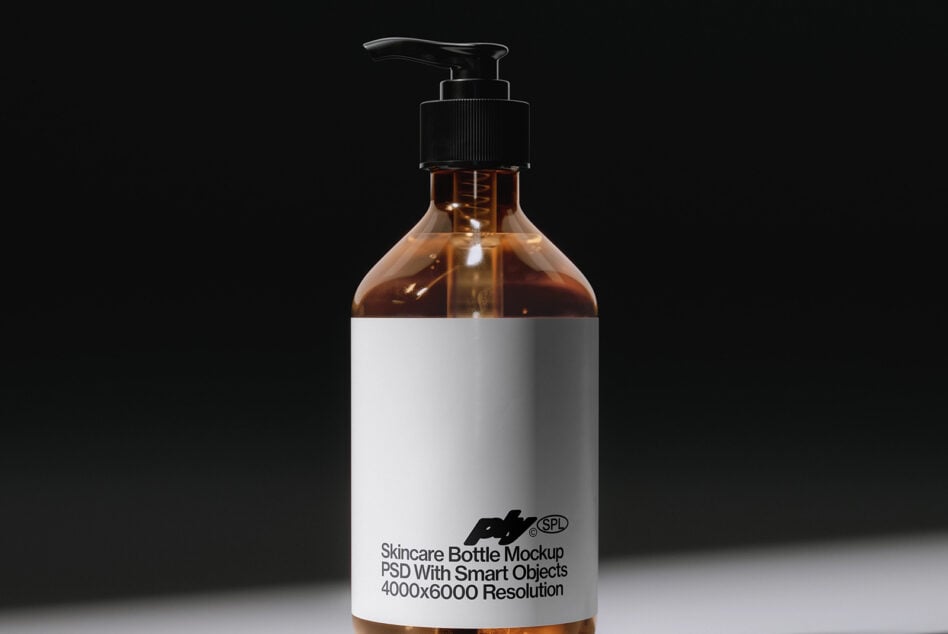Amber glass pump bottle mockup with branded label showing smart objects