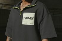 Black quarter zip pullover with label mockup worn by male model