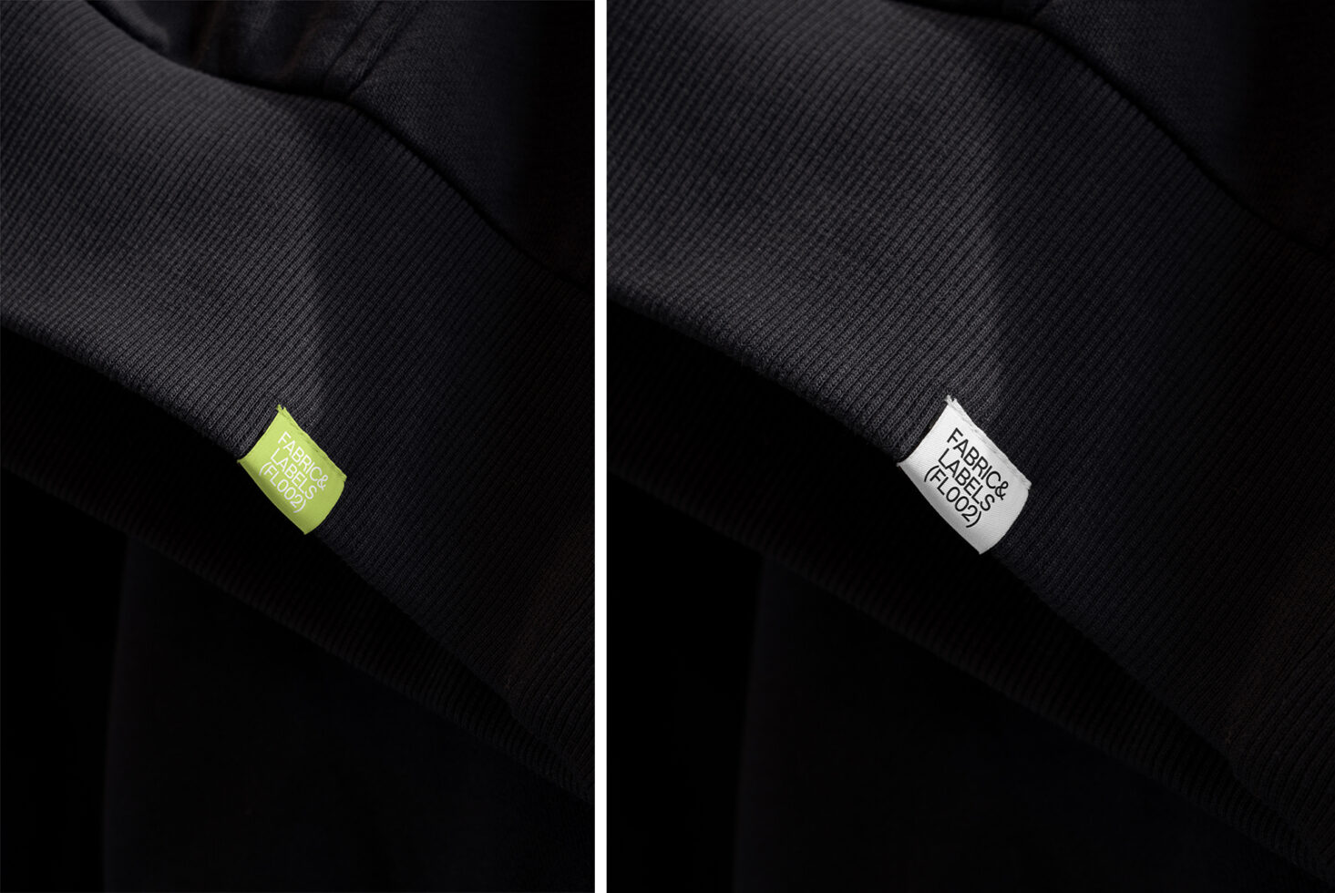 Lime green plus white fabric label badges on dark ribbed knit material closeup