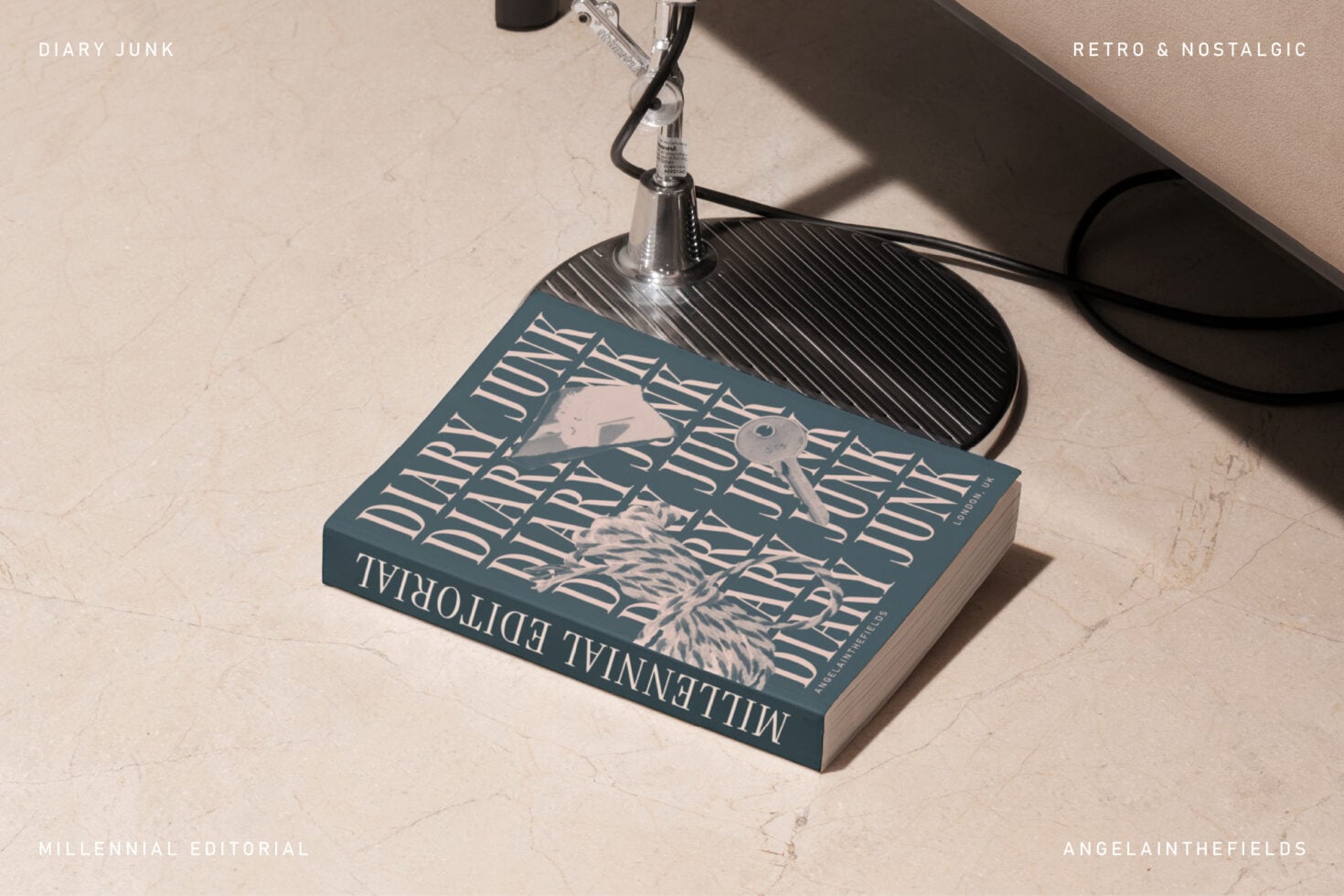 Hardcover book mockup under desk lamp showing striped typography cover design
