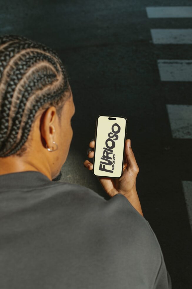 Overhead view of phone with cream screen showing black FURIOSO Mockups text
