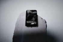 iPhone mockup displaying sample text on concrete platform