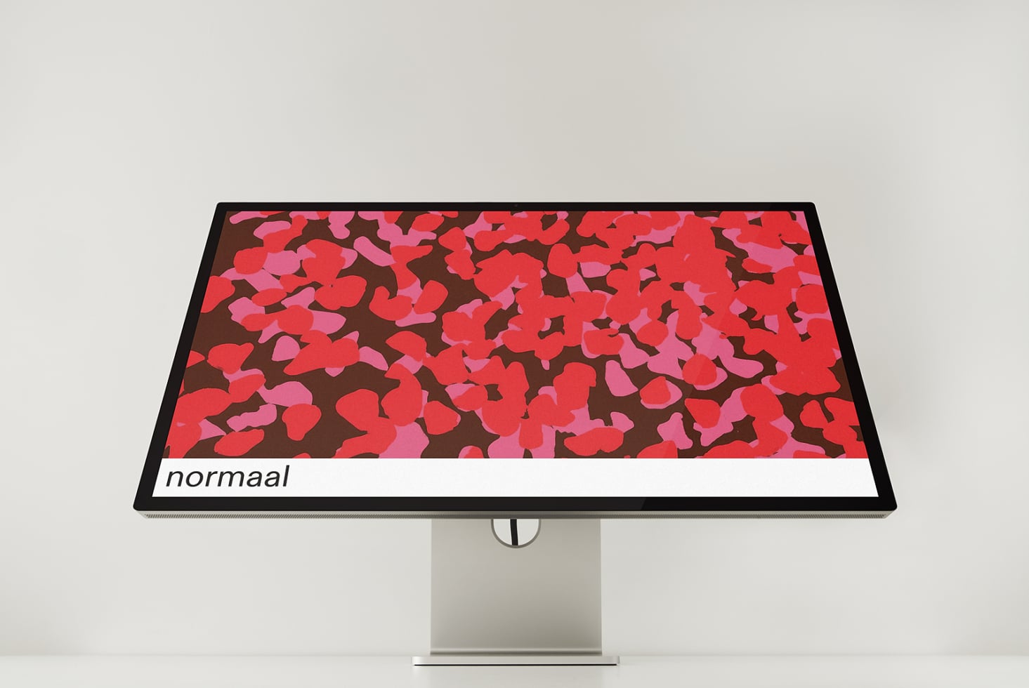 Landscape monitor showing red pink abstract floral design with normaal text