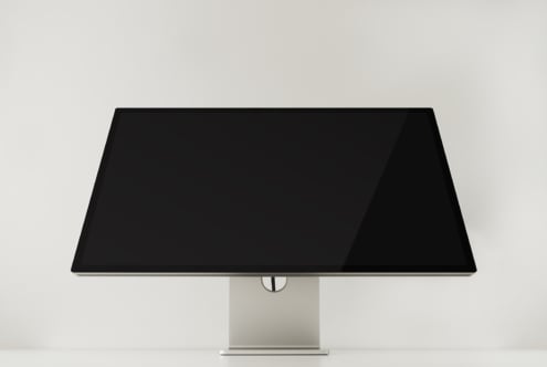 Wide desktop monitor mockup overhead view on light background