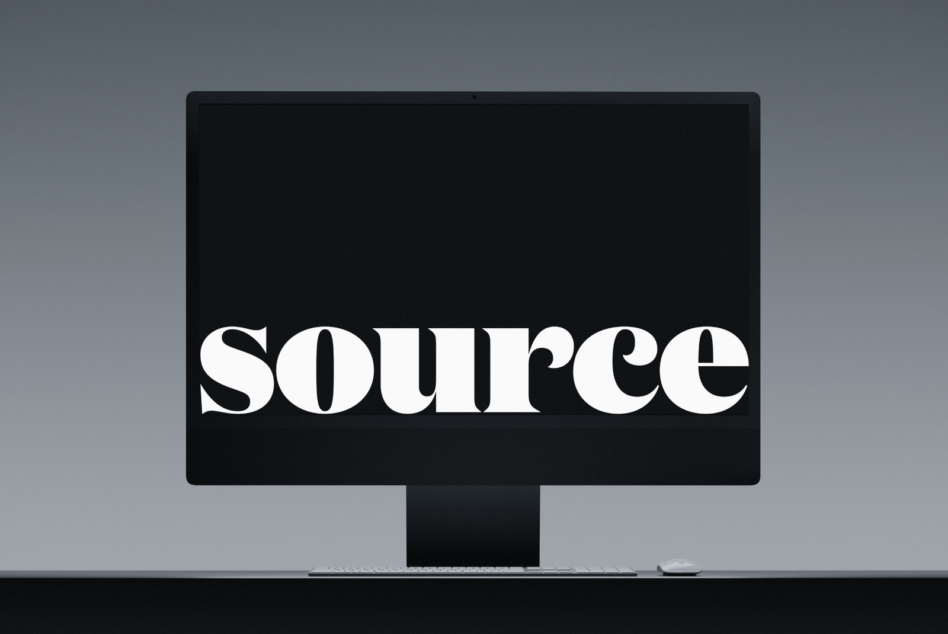 Desktop monitor mockup with keyboard, mouse displaying white serif text on black
