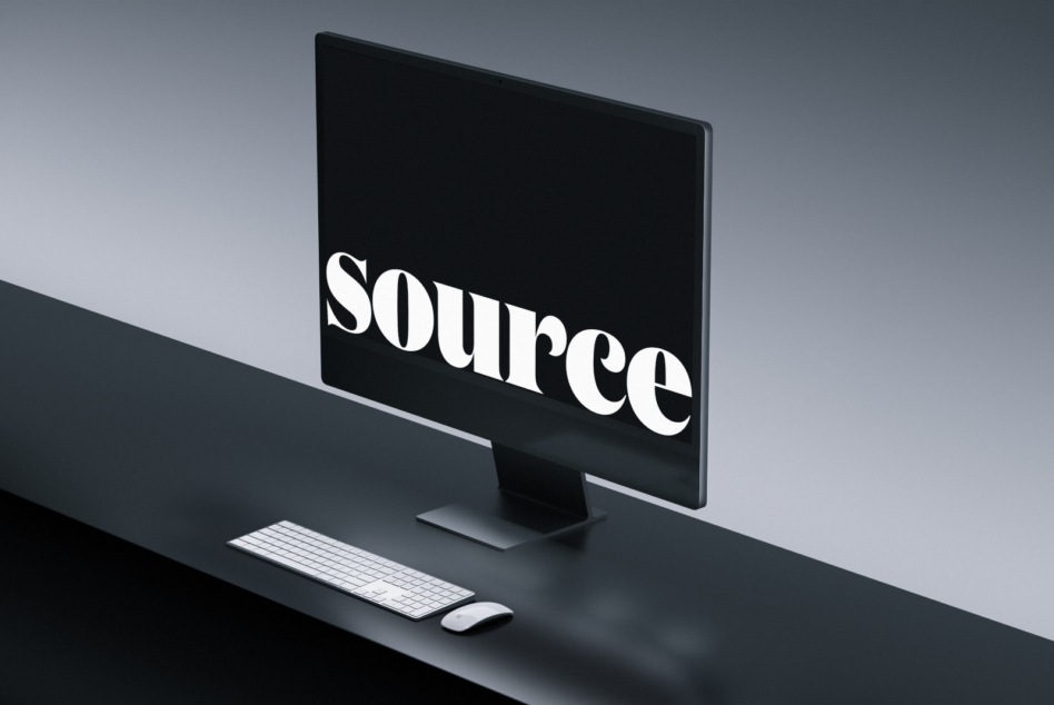 Desktop monitor mockup with keyboard, mouse showing white text on black screen