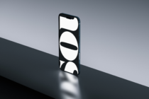 Smartphone displaying minimalist circular shapes on black background
