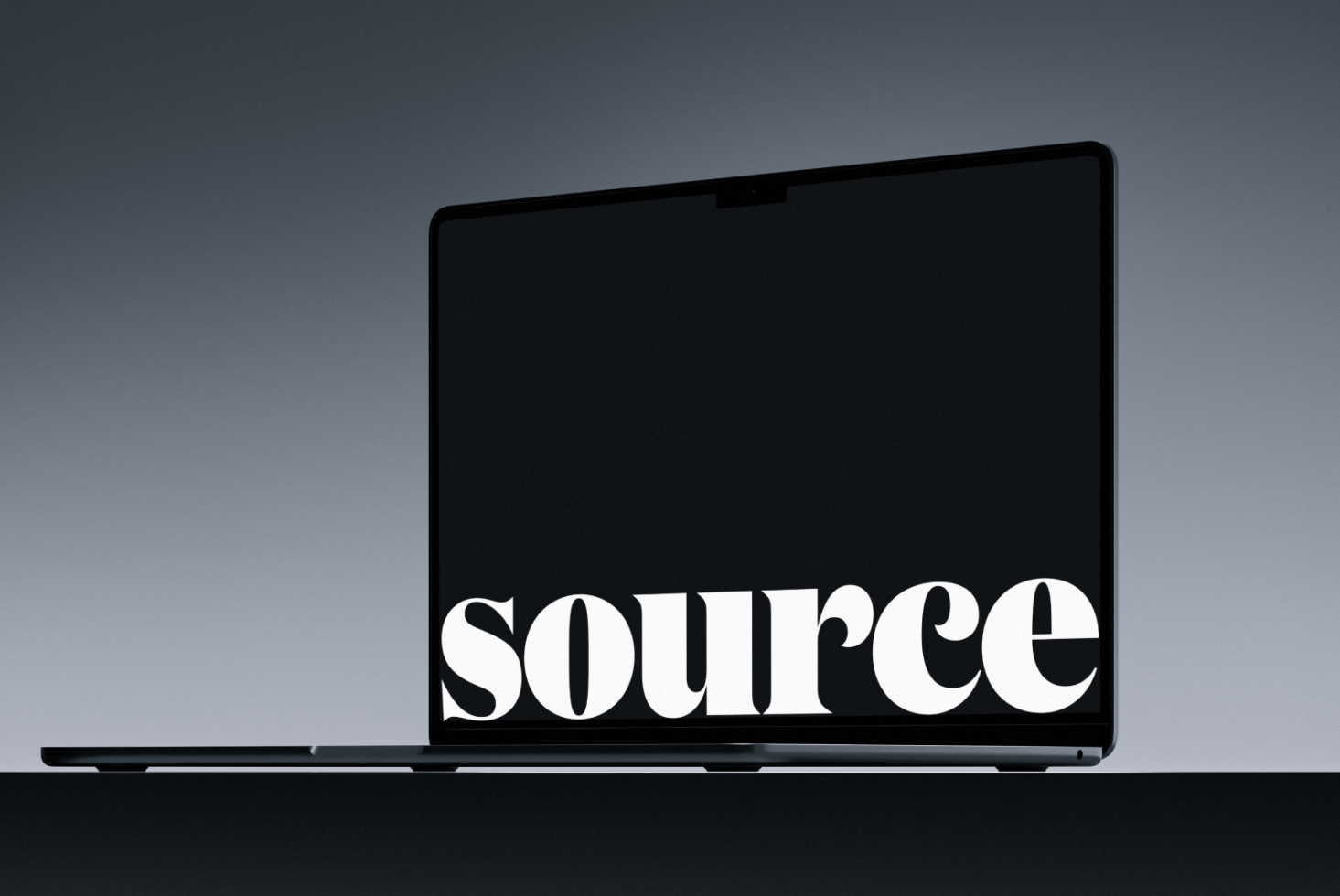Laptop mockup with bold serif text centered on dark screen