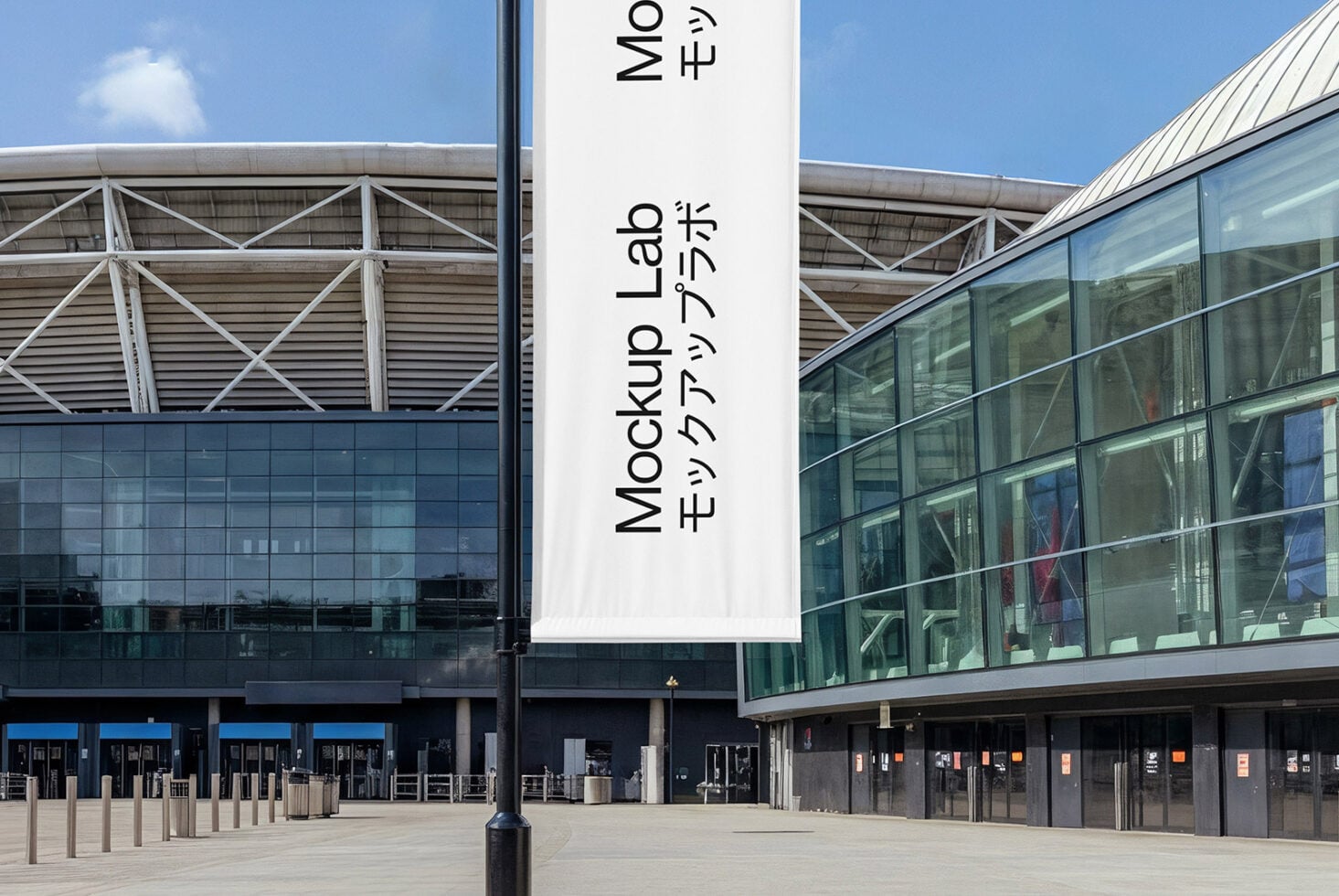 White fabric banner hanging on pole in front of modern building courtyard
