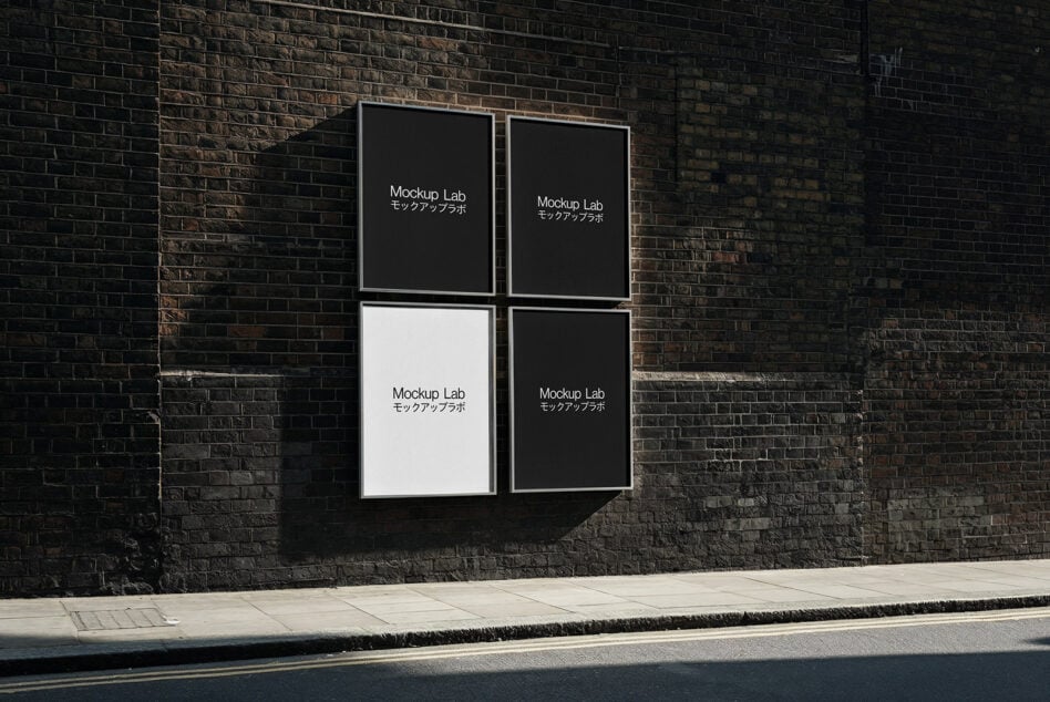 Four frame grid mounted on dark brick wall with poster layouts