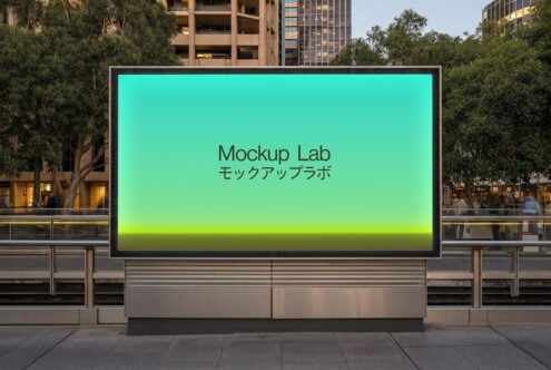 Teal to yellow gradient screen on dark frame in busy downtown outdoor location