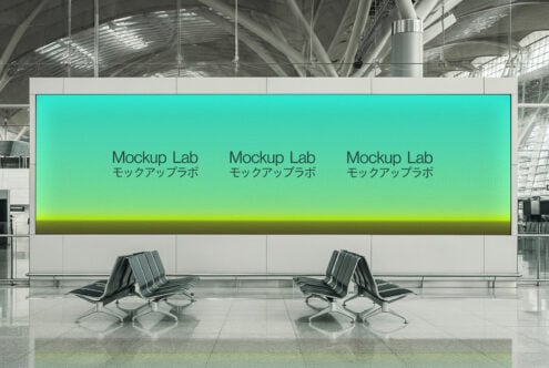 Cyan yellow ombre display in modern terminal lobby between two designer lounge seats