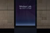 Dark tablet on textured wall displaying Mockup Lab with blue gradient background