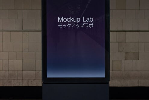 Dark tablet on textured wall displaying Mockup Lab with blue gradient background