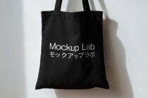 Black tote with Mockup Lab bilingual text on white background