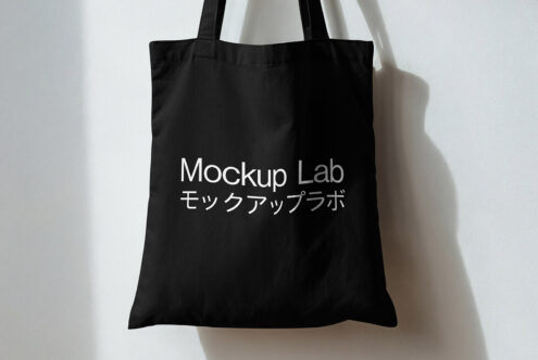 Black tote with Mockup Lab bilingual text on white background